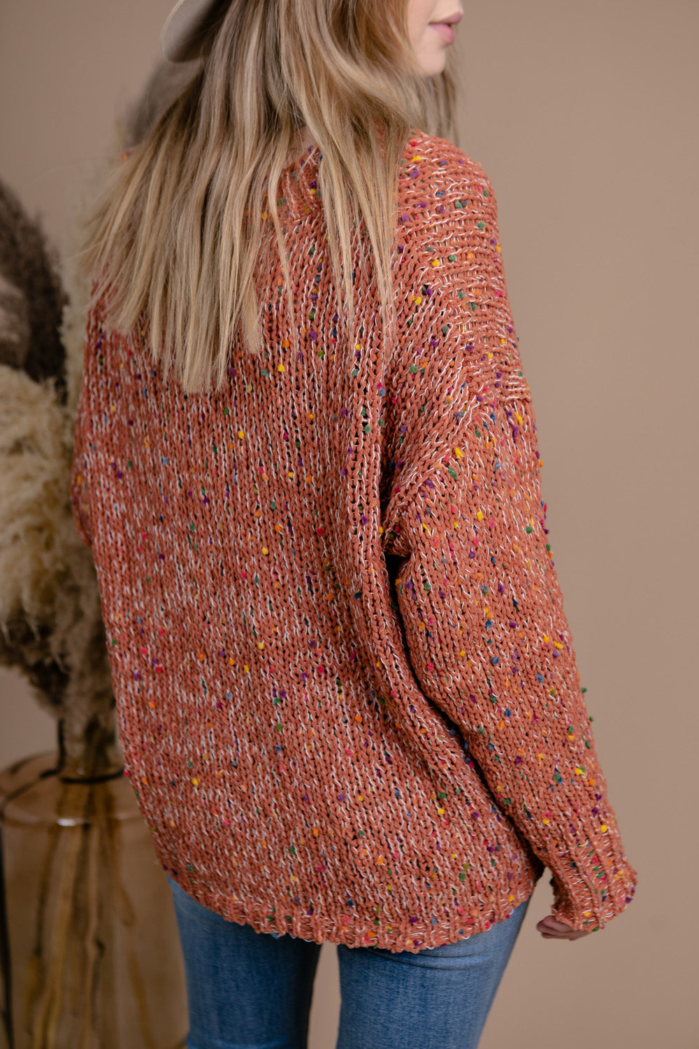 chunky knit vneck popcorn style sweater with coloured flecks throughout and drop sleeves